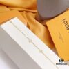 692fcce399f2d84055c89744 LV Gold-Tone Letter and Flower Bracelet
