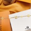 692fcce499f2d84055c89745 LV Gold-Tone Letter and Flower Bracelet