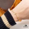 692fcce599f2d84055c89747 LV Gold-Tone Letter and Flower Bracelet