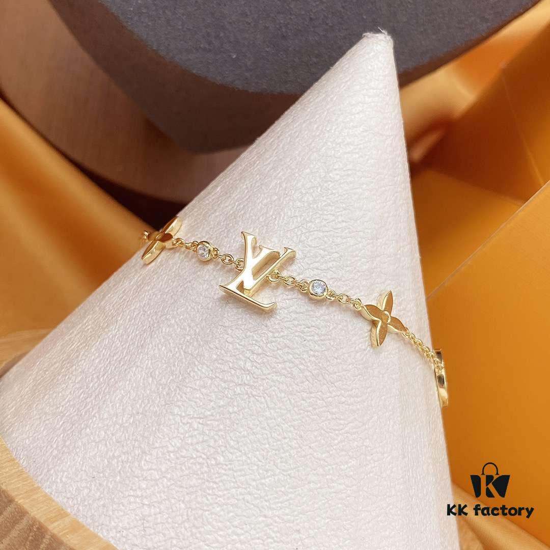 692fcced99f2d84055c89756 LV Gold-Tone Letter and Flower Bracelet