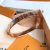 692fcd1399f2d84055c8979f Exclusive In-Stock! LV NANOGram Bracelet with Classic Monogram Pattern, Wide Cuff Design with Louis Vuitton Rivets, Elegant and Unique, Perfect for Daily Wear