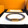 692fcd2b99f2d84055c897d6 Louis Vuitton LV Monogram Leather Bracelet ● Authentic Replica, Best Quality on Market, Brass Hardware, Calfskin Lining, Unique Retro-Futuristic Design, Must-Have for Women