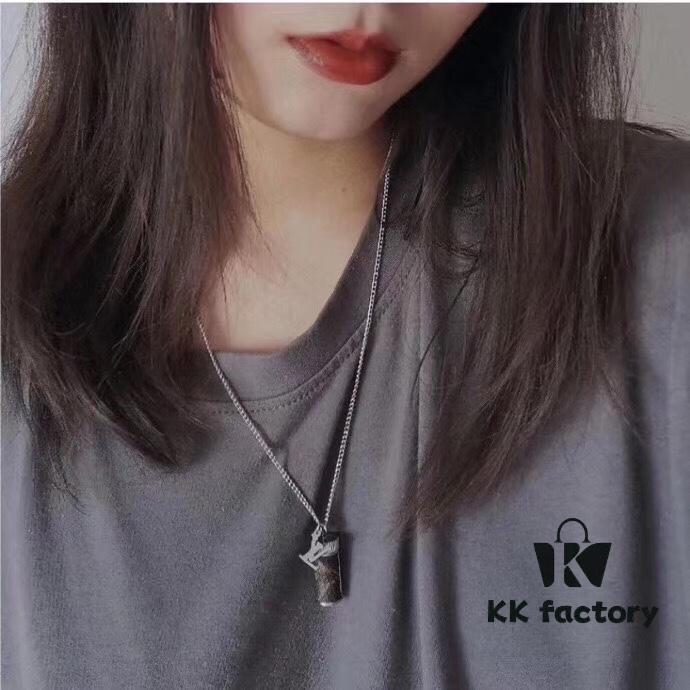 692fcdc899f2d84055c898f9 LV Perfume Bottle Necklace, Rotatable Design with Monogram Leather Accent, Unisex Fashion Pendant for Fragrance or Charms