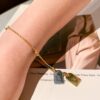 692fcf5899f2d84055c89bc8 LV Unisex Nanogram Dual-Pendant Necklace Bracelet