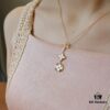 692fcfc699f2d84055c89c97 Exquisite ZP LV Jewelry with Classic Flower Design, White and Pink Mother-of-Pearl Accents, and a Touch of Diamond Sparkle