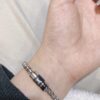 692fd04c99f2d84055c89d82 LV Necklace/Bracelet with Rotating Opening, Incorporating Monogram Leather for Personal Fragrance or Amulet