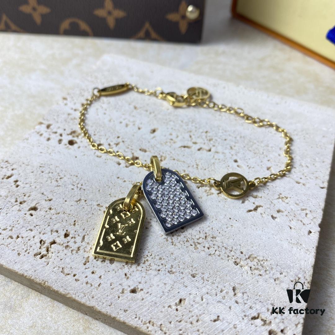 692fd11499f2d84055c89edc A pair of name tags engraved with the classic LV Initials signature, featuring contrasting gold and silver finishes, a soft pearl chain, and a buckle adorned with the LV Circle logo.