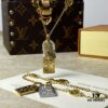 692fd11899f2d84055c89ee0 A pair of name tags engraved with the classic LV Initials signature, featuring contrasting gold and silver finishes, a soft pearl chain, and a buckle adorned with the LV Circle logo.