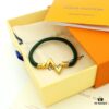692fd13199f2d84055c89f0e LV Braided Bracelet in Colorful Volt Play 18K Gold Bracelet with Interlocking L and V Motif