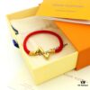 692fd13299f2d84055c89f0f LV Braided Bracelet in Colorful Volt Play 18K Gold Bracelet with Interlocking L and V Motif