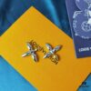 692fd13599f2d84055c89f15 Lousiette Stud Earrings Subtly Presenting the Quiet Bloom of Monogram Flowers