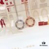 692fd19e99f2d84055c8a00e Bestseller New Arrival CARTIER Love Series Diamond-Paved Round Necklace in White Gold and Rose Gold