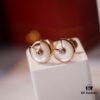 692fd40999f2d84055c8a482 Cartier Amulette de Cartier Classic Stud Earrings, Round Bezel with White Mother-of-Pearl and Green Malachite, CNC Precision-Carved Triple-Layer UFO Design, Double-Sided Inlay, Exquisite Craftsmanship