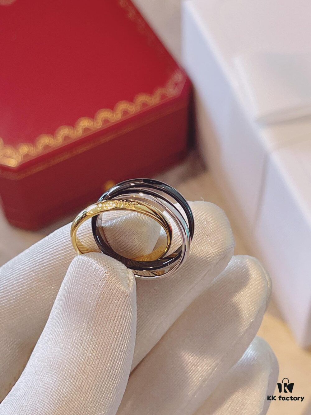 692fd41799f2d84055c8a498 Cartier Trinity Three-Band Ring in Yellow Gold, White Gold, and Black Ceramic