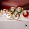 692fd41799f2d84055c8a49a Cartier Amulette de Cartier Classic Stud Earrings, Exquisite CNC-Carved Lucky Charm with White Mother-of-Pearl and Green Malachite, Dual-Tone Design, Triple-Layer Flying Saucer Pendant, Fully Encrusted with Brilliant Diamonds