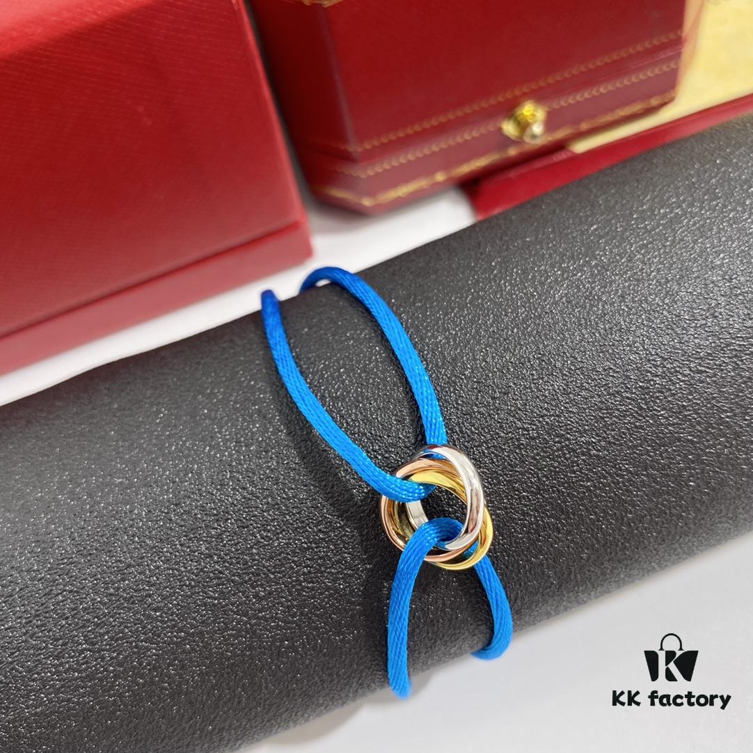 692fd42899f2d84055c8a4b3 Cartier Three-Ring Tricolor 18K Lucky Red Braided Adjustable Bracelet