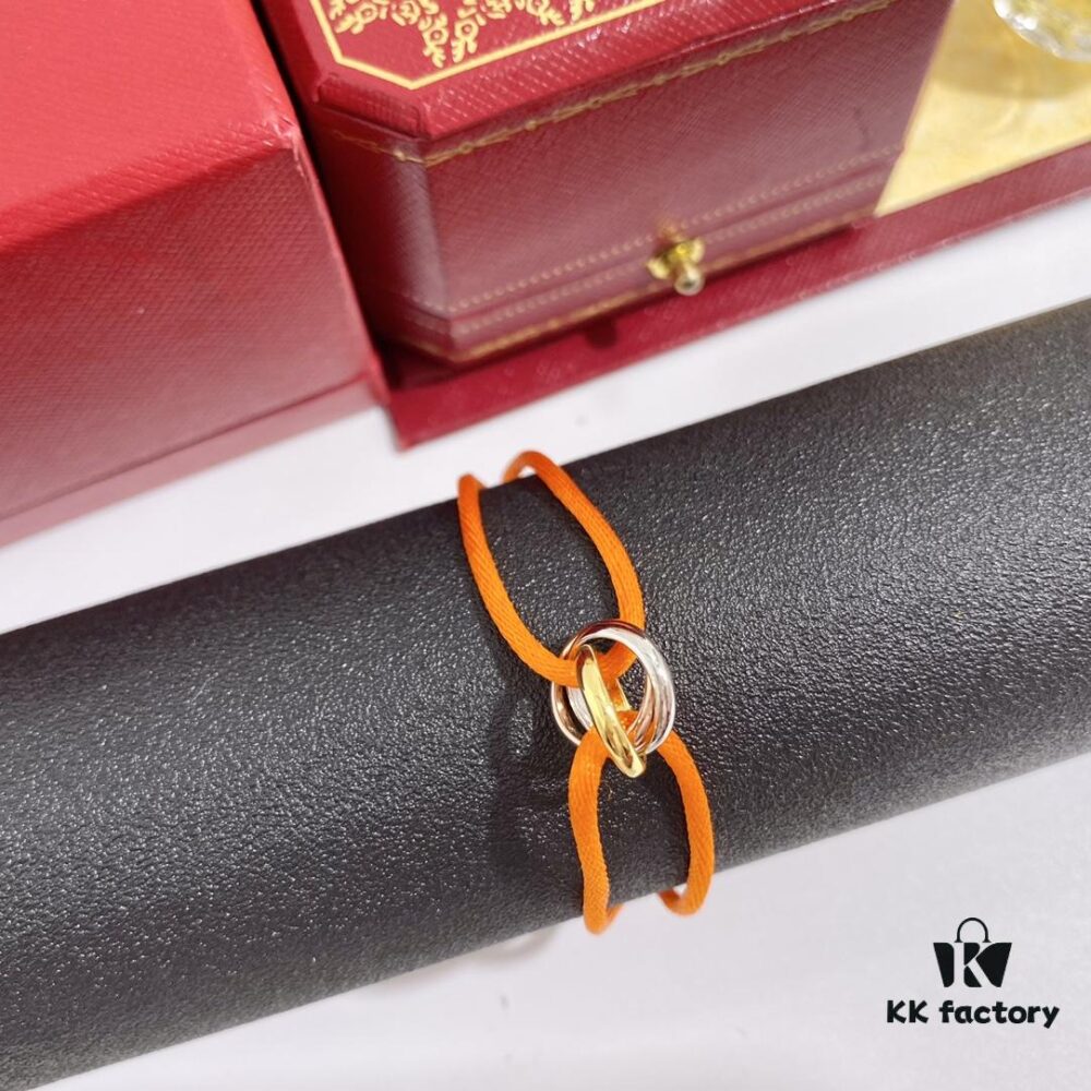 692fd42a99f2d84055c8a4b6 Cartier Trinity Three-Ring Multicolor 18K Gold Adjustable Lucky Red String Bracelet