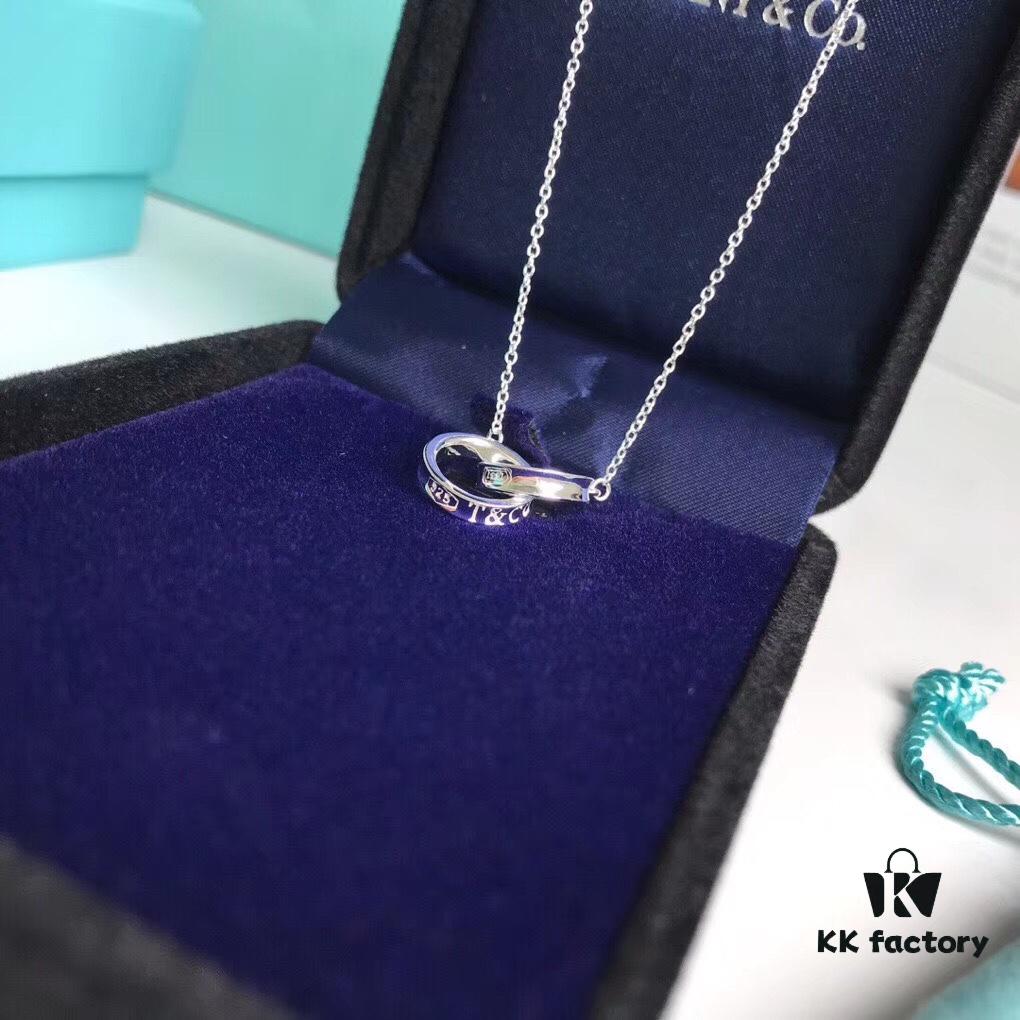 692fd58099f2d84055c8a704 Tiffany & Co. T1837 Double Ring Necklace with Toggle Closure, Fashionable Silver Pendant Inspired by the Brand's Founding Year