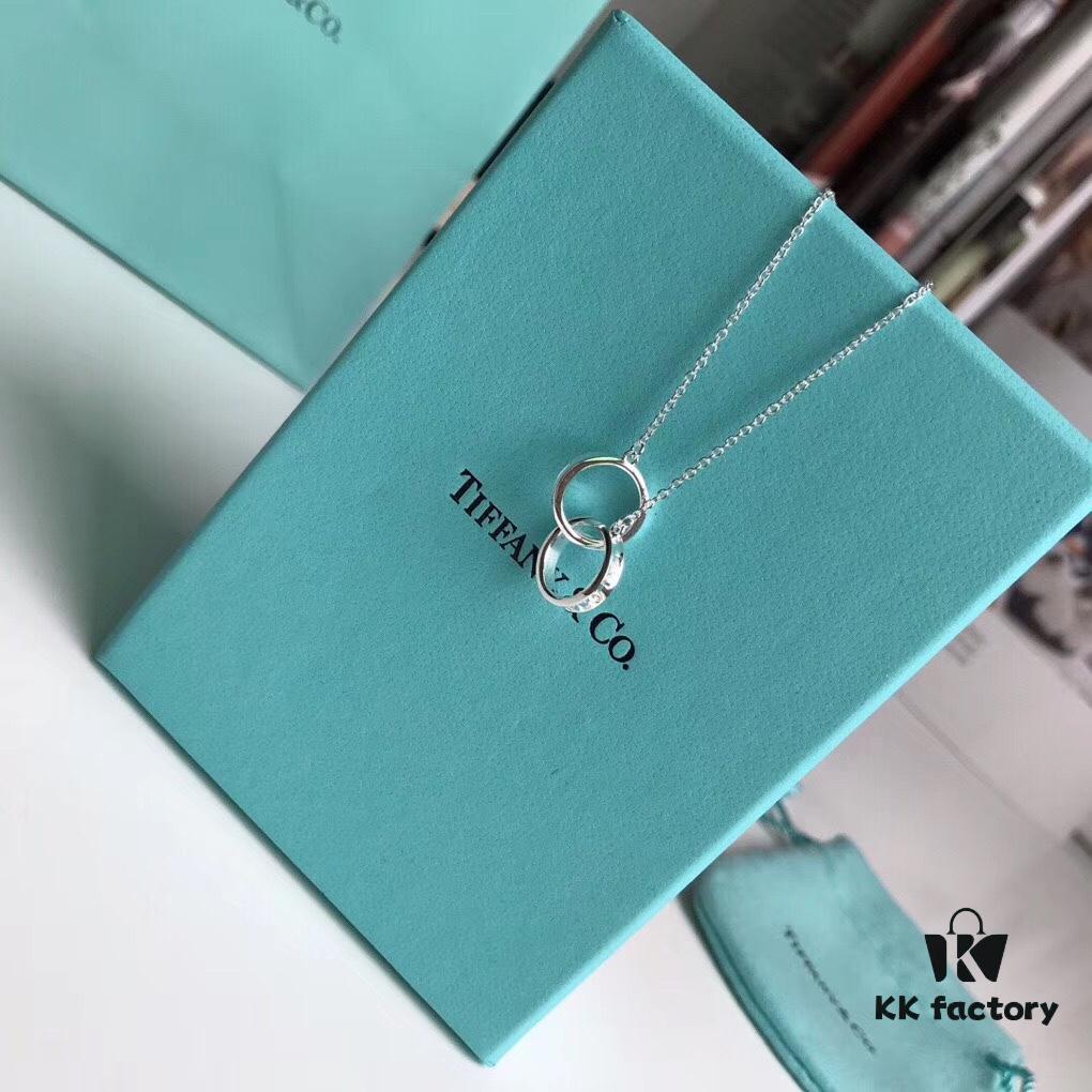 692fd58299f2d84055c8a706 Tiffany & Co. T1837 Double Ring Necklace with Toggle Closure, Fashionable Silver Pendant Inspired by the Brand's Founding Year