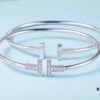 692fd5e299f2d84055c8a7c3 Must-have Tiffany & Co. Double T Diamond Bracelet with Adjustable Memory Design, AU750 Logo Stamp, S925 Silver Plated with 18K Gold, Set with 5A Zirconia