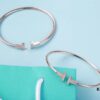 692fd5e299f2d84055c8a7c7 Must-have Tiffany & Co. Double T Diamond Bracelet with Adjustable Memory Design, AU750 Logo Stamp, S925 Silver Plated with 18K Gold, Set with 5A Zirconia