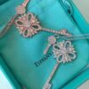 692fd61d99f2d84055c8a85e Tiffany & Co. Classic Double Key Snowflake Sweater Chain with Small Yellow Diamond Accents, Featuring Elegant Logo, Available in White Gold and Rose Gold