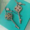 692fd62099f2d84055c8a862 Tiffany & Co. Classic Double Key Snowflake Sweater Chain with Small Yellow Diamond Accents, Featuring Elegant Logo, Available in White Gold and Rose Gold