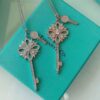692fd62399f2d84055c8a866 Tiffany & Co. Classic Double Key Snowflake Sweater Chain with Small Yellow Diamond Accents, Featuring Elegant Logo, Available in White Gold and Rose Gold