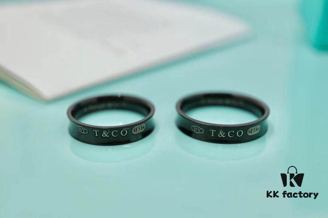 692fd64099f2d84055c8a89f Tiffany & Co. 1037 Titanium Ring 🌷🌷 The Tiffany 1837™ Collection, engraved with the founding year of Tiffany, is perfectly interpreted through smooth curves and elegant contours. This sophisticated ring is a timeless classic. An ideal choice for couples 👫, best friends, or as a single band 💒. Made of titanium, hypoallergenic.