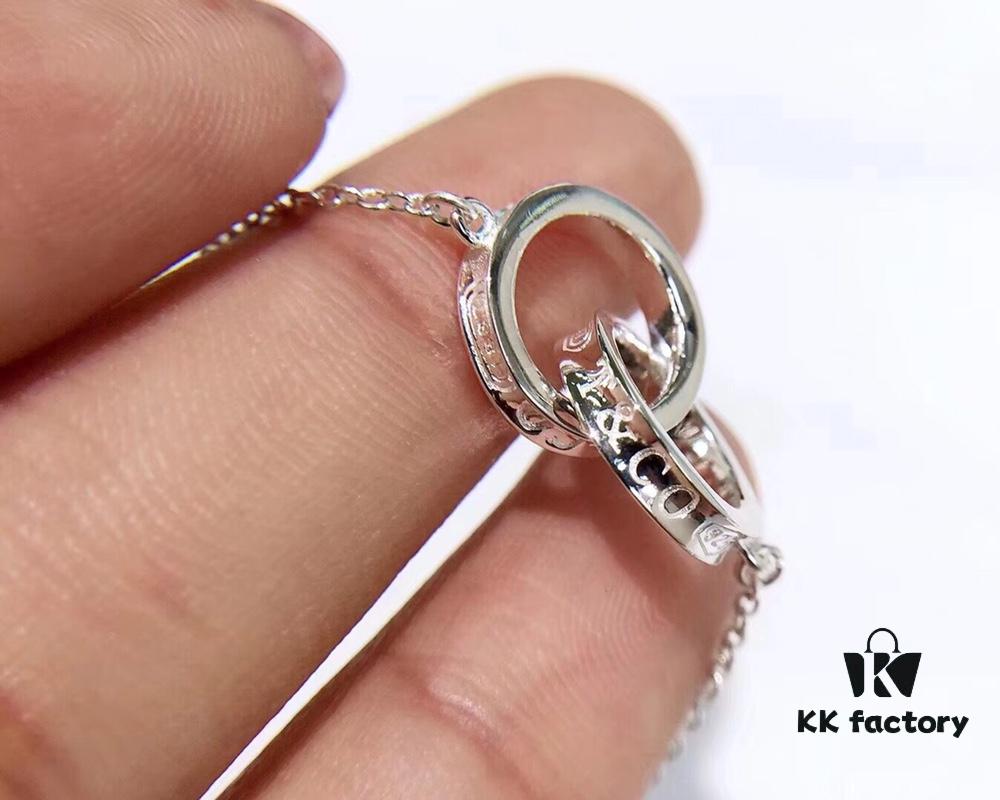 692fd64f99f2d84055c8a8c5 Tiffany Double Ring Necklace with Dual Hoop Pendant Featuring Engraved Founding Year