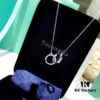 692fd65399f2d84055c8a8cd Tiffany Double Ring Necklace with Dual Hoop Pendant Featuring Engraved Founding Year