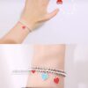 Woman Wearing Tiffany Heart Bracelet