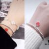 Woman Wearing Tiffany Heart Bracelet
