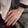 Woman Wearing Tiffany Heart Bracelet