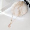 692fda9a99f2d84055c8aff0 Exquisitely Crafted Gourd Pendant Necklace with Hand-Set Stones, V-Gold Material, Unique Design