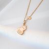 692fda9a99f2d84055c8aff1 Exquisitely Crafted Gourd Pendant Necklace with Hand-Set Stones, V-Gold Material, Unique Design