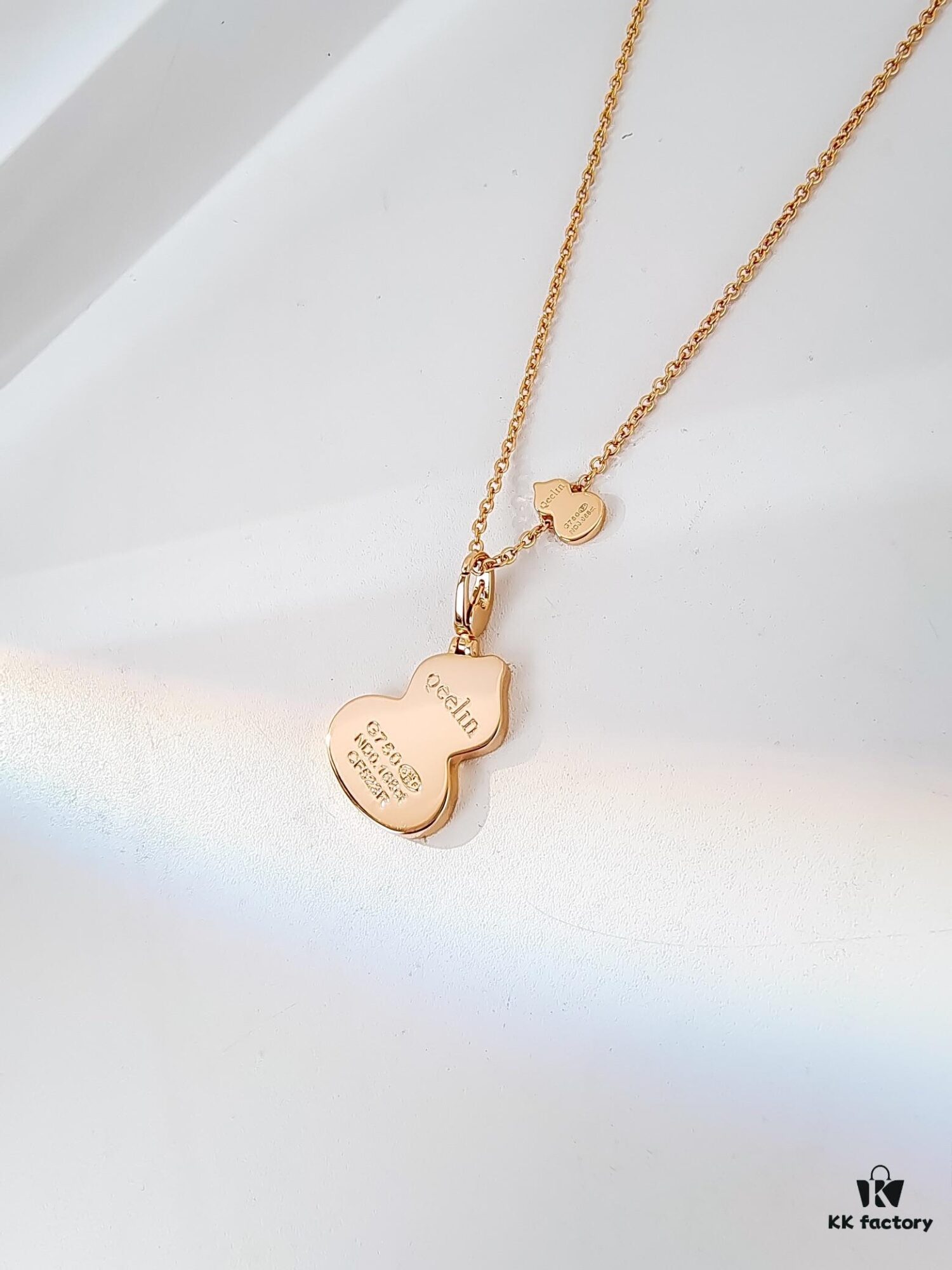 692fda9a99f2d84055c8aff1 Exquisitely Crafted Gourd Pendant Necklace with Hand-Set Stones, V-Gold Material, Unique Design
