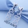 692fddda99f2d84055c8b56c HEFANG Jewelry Cream Twirl Earrings - Limited Edition Ear Studs, Celebrity Style (Zhou Yutong's Pick), Ideal Gift for Qixi Festival