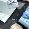 692fdf8e99f2d84055c8b76f He Fang Aurora Ribbon Knot Collarbone Necklace, Exquisitely Crafted from S925 Silver with Shimmering Diamond Accents and Colorful Iridescent Cube Pendant