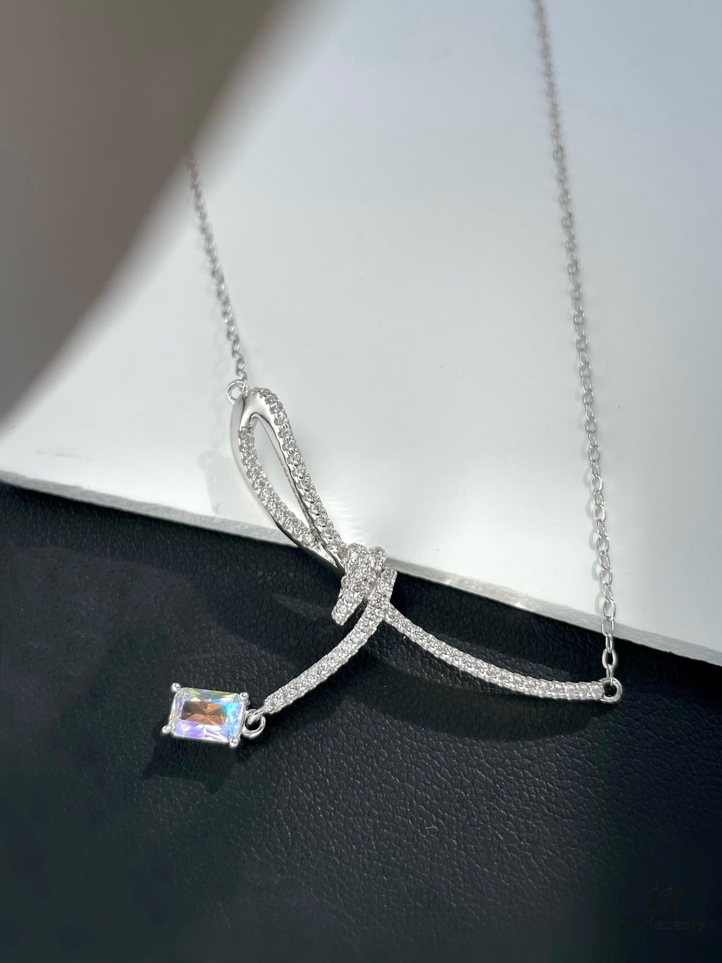 692fdf9199f2d84055c8b772 He Fang Aurora Ribbon Knot Collarbone Necklace, Exquisitely Crafted from S925 Silver with Shimmering Diamond Accents and Colorful Iridescent Cube Pendant