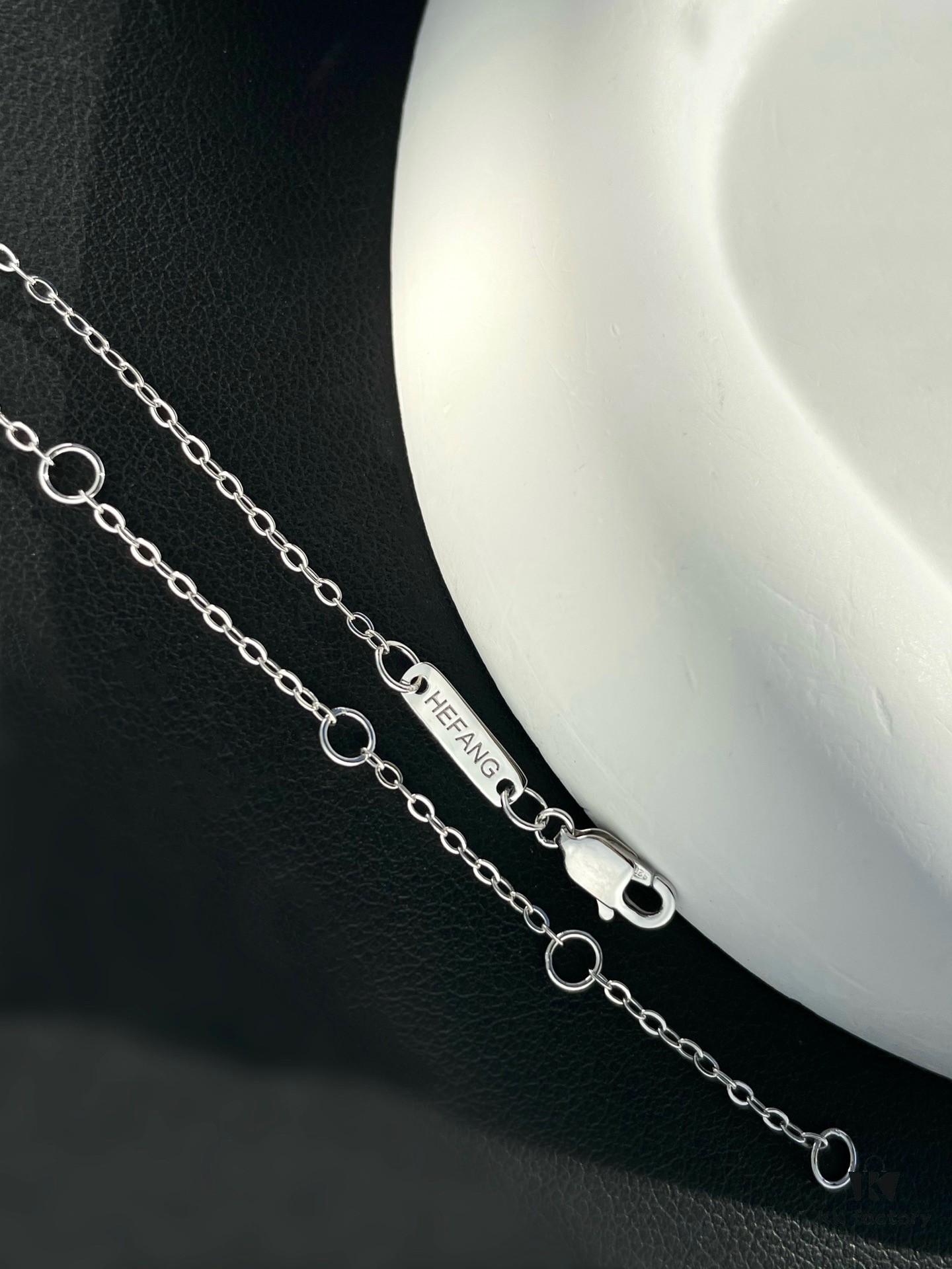 692fdf9499f2d84055c8b777 He Fang Aurora Ribbon Knot Collarbone Necklace, Exquisitely Crafted from S925 Silver with Shimmering Diamond Accents and Colorful Iridescent Cube Pendant