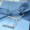 692fdf9899f2d84055c8b77a He Fang Aurora Ribbon Knot Collarbone Necklace, Exquisitely Crafted from S925 Silver with Shimmering Diamond Accents and Colorful Iridescent Cube Pendant