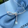 692fdfb599f2d84055c8b7ad He Fang Aurora Ribbon Knot Collarbone Necklace, Exquisitely Crafted from S925 Silver with Shimmering Diamond Accents and Colorful Iridescent Cube Pendant