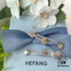 692fdfd899f2d84055c8b7ed HEFANG Blossom Collection Rose Ribbon Earrings