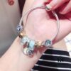 692fe1b199f2d84055c8bafd Pandora Pandora Gold Thread Light Mint North Star New Arrival! Made with counter materials, perfectly crafted one-to-one, quality comparable to counter products! A bag full of happiness, wealth-attracting money pouch, coin bead mint cat's eye, North Star pendant, S925 silver with original counter packaging!