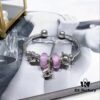 692fe1bd99f2d84055c8bb16 Pandora Afternoon Tea Collection - Elegant Purple Glow Bead with Heart Bow, Teapot Fairy, and Pink Cup Design
