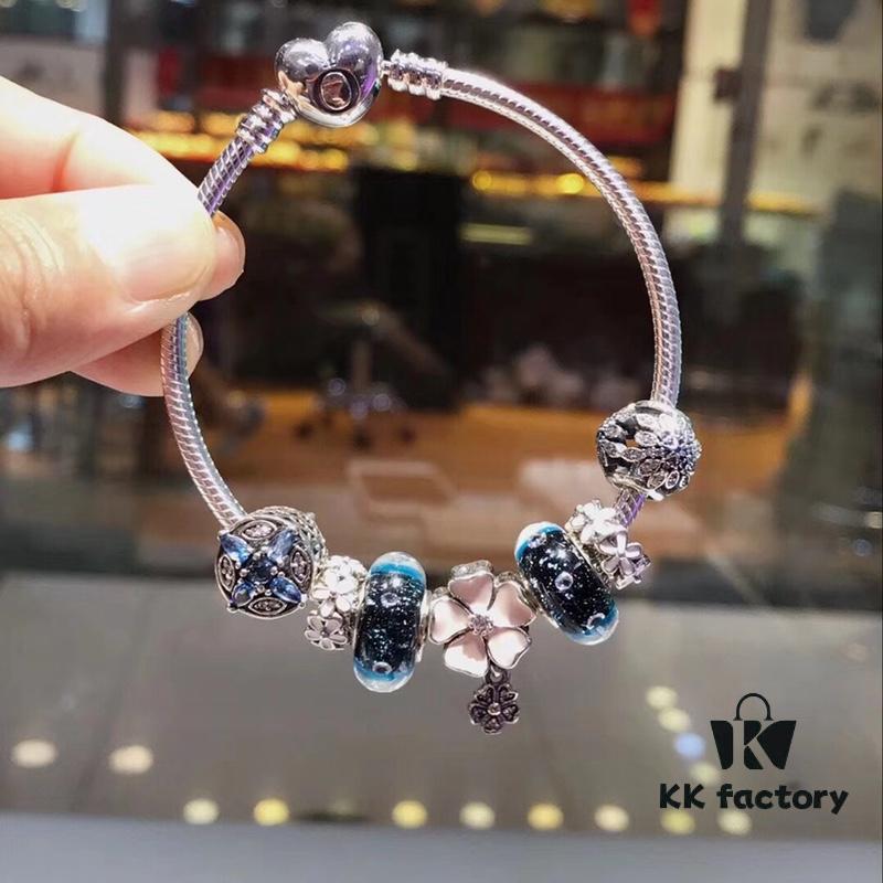 692fe1ff99f2d84055c8bbbe Pandora Night Sky Blue Elegant Pink Flower Design! Crafted with authentic boutique materials, perfectly replicating the original store quality. Features night sky blue bubbled glass, delicate cherry blossom spacers, cross snowflake charm, elegant pink flower accent, and is made of S925 silver, complete with official boutique packaging!