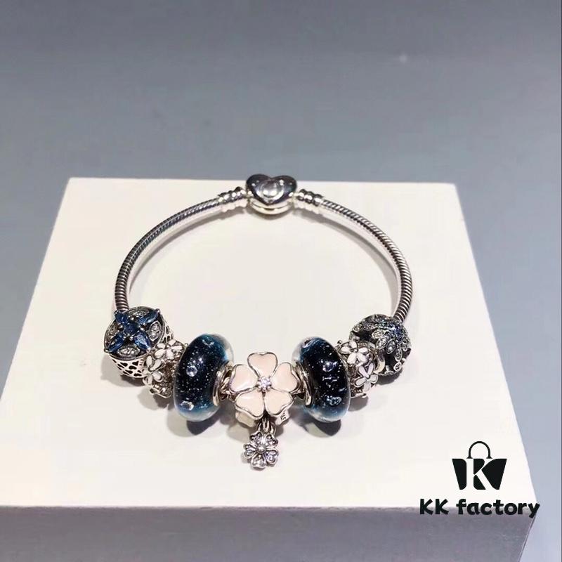 692fe20199f2d84055c8bbc2 Pandora Night Sky Blue Elegant Pink Flower Design! Crafted with authentic boutique materials, perfectly replicating the original store quality. Features night sky blue bubbled glass, delicate cherry blossom spacers, cross snowflake charm, elegant pink flower accent, and is made of S925 silver, complete with official boutique packaging!