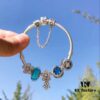 692fe34299f2d84055c8be35 Pandora Lake Blue Bubble Daisy Flower Blossom 🌼 New Arrival! Made with authentic boutique materials, perfectly crafted to match retail quality! Featuring vibrant lake blue bubble glass, sparkling ocean blue cat's eye stone, lucky coin charm, fully diamond-set daisy flower and daisy safety chain, paired with a diamond-encrusted daisy pendant. Crafted in S925 sterling silver, complete with official boutique packaging!