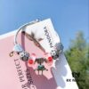 692fe47299f2d84055c8c082 Pandora Pink Kiss 👄 New Bella Mini Doll Charm! Orange-pink lip enamel with white daisy enamel bead, Valentine's heart charm 💗, four-leaf clover spacer, paired with robot Bella pendant. Made from authentic materials, 1:1 replica with S925 silver and official retail packaging!